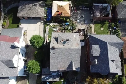 Aerial view of houses with roof work.